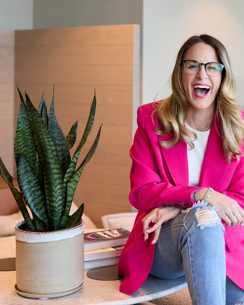 Sarah Pirie-Nally laughing, wearing glasses
